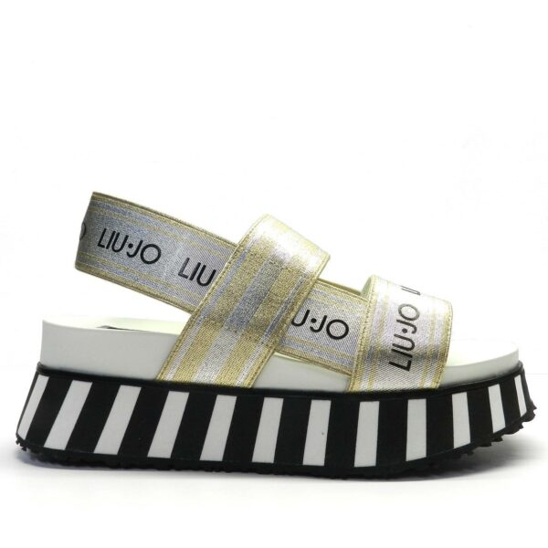 Sandalia marca LiuJo modelo FRIDA 2 en color oro y blanco. Sandalias de plataforma con suela de goma a rayas y bandas elásticas de lurex® con logotipos; el complemento perfecto para un look deportivo sofisticado